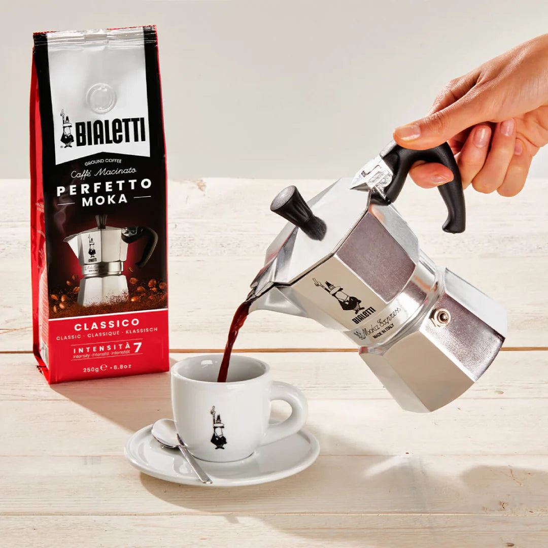 Bialetti Moka Express stovetop coffee maker with black handle and shiny aluminum body for brewing espresso-style coffee