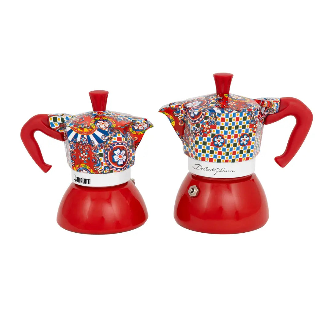 Bialetti Dolce&Gabbana Sicilian Cart Moka Induction stovetop coffee maker in 2 and 4 cup sizes with colorful Sicilian design.