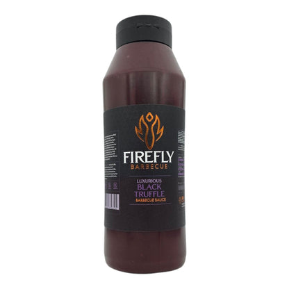 Black truffle BBQ sauce from FireFly Barbecue in a 1-liter bottle, showcasing a rich, dark sauce with black truffle pieces.