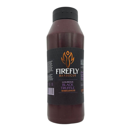 Black truffle BBQ sauce from FireFly Barbecue in a 1-liter bottle, showcasing a rich, dark sauce with black truffle pieces.