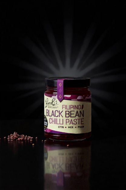 RoniBs Kitchen Filipino Black Bean Chilli Paste hot sauce with dark background, showcasing rich, dark paste and spicy ingredients.