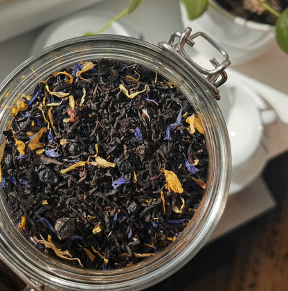 Loose leaf Black Tea with blueberry and maple flavors by Porter Hill Tea Company, showcasing vibrant blue and brown tea leaves.