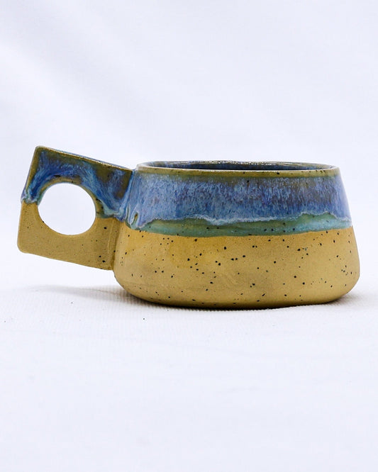 Handmade Bluverde Formo ceramic stoneware coffee mug by Ribera Handmade Ceramics with a blue glaze finish.