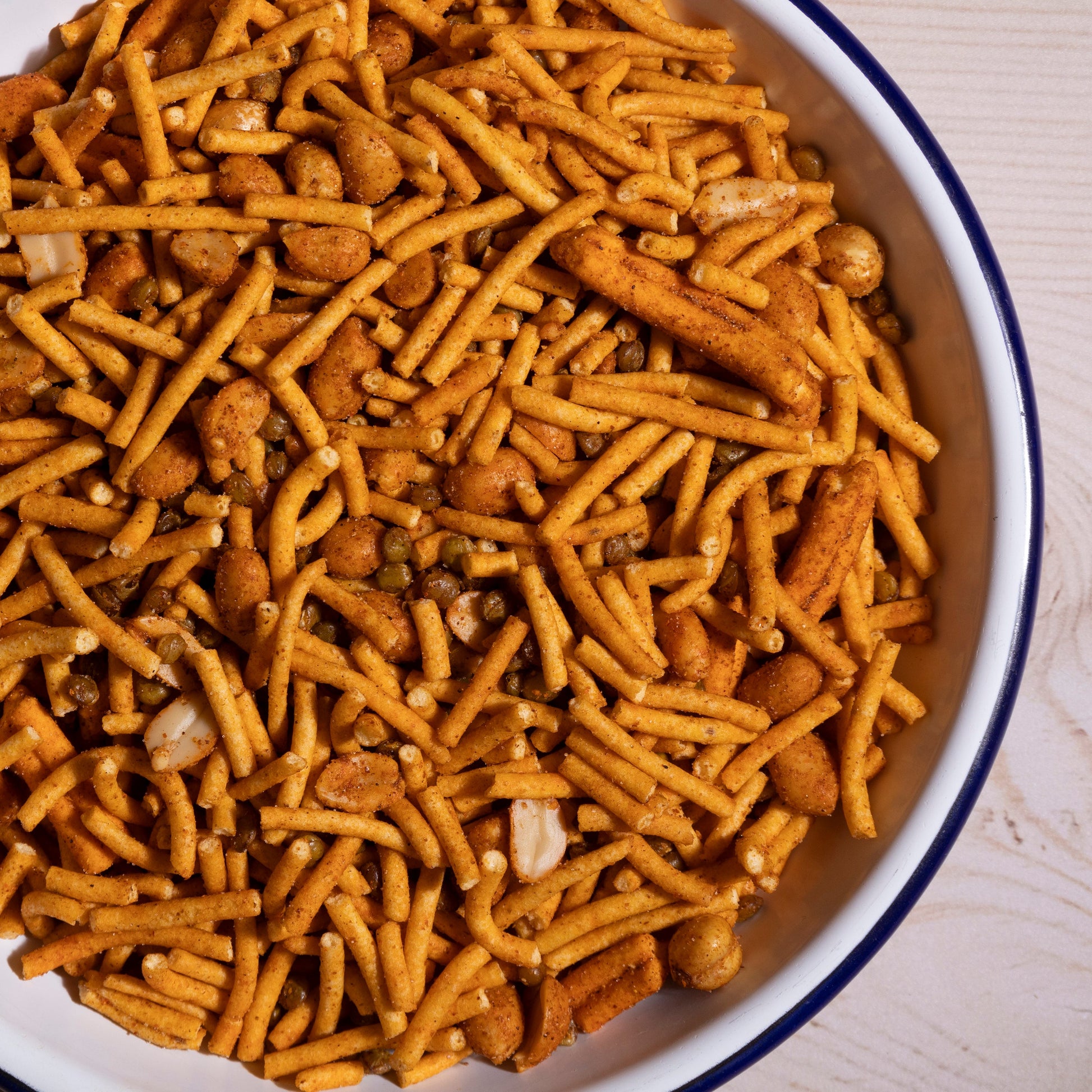 Whole Food Earth Bombay Mix with gram flour noodles, peas, peanuts, and lentils, showcasing a colorful assortment of ingredients.