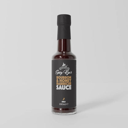 Spicy Ryes Bourbon & Honey BBQ Sauce bottle for grilling, featuring a dark caramel color and label design.