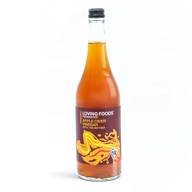 Loving Foods apple cider vinegar bottle with "The Mother" in a glass bottle on a white background.