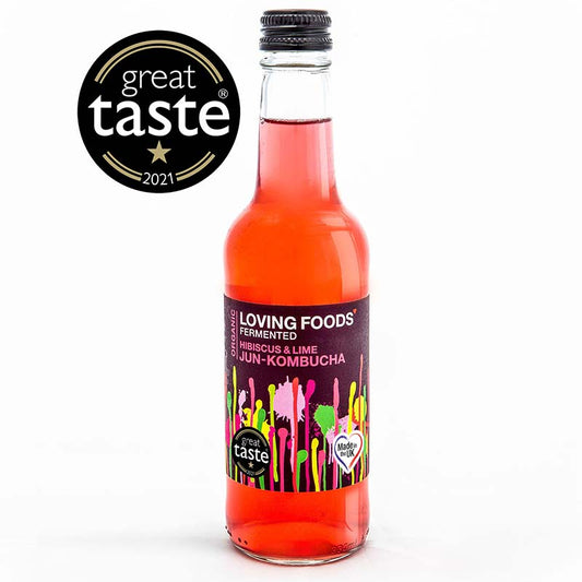 Organic Loving Foods Jun-Kombucha bottle with hibiscus and lime flavor, featuring a clear glass bottle with colorful fruit illustrations.