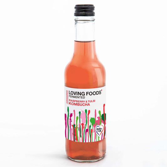 Organic Kombucha bottle by Loving Foods with raspberry and tulsi flavor, featuring a clear glass bottle and colorful label.