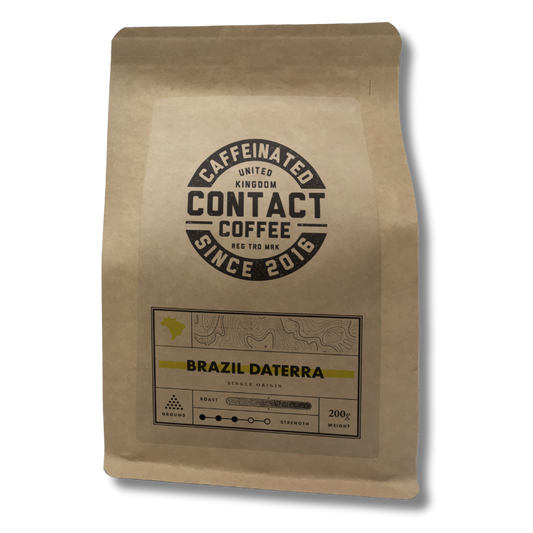 Ground Single Origin Brazil Daterra coffee from Contact Coffee Company Ltd., rich roasted beans ready for brewing.