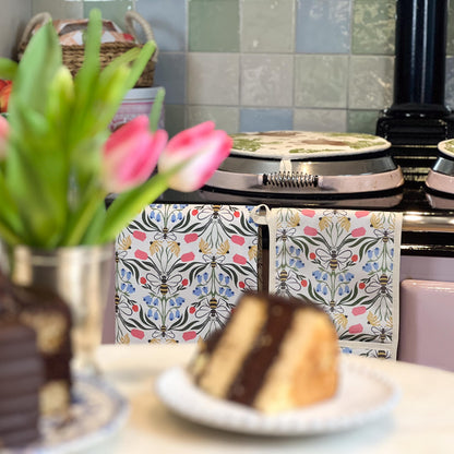 British Bees oven gloves from Avalon Home UK featuring a bee and honeycomb pattern, designed for heat protection in the kitchen.
