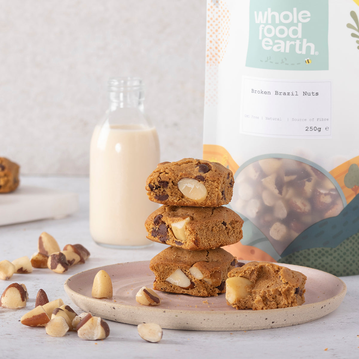 Broken Brazil nuts from Whole Food Earth, showing cracked nut pieces and textured shells on a natural background.