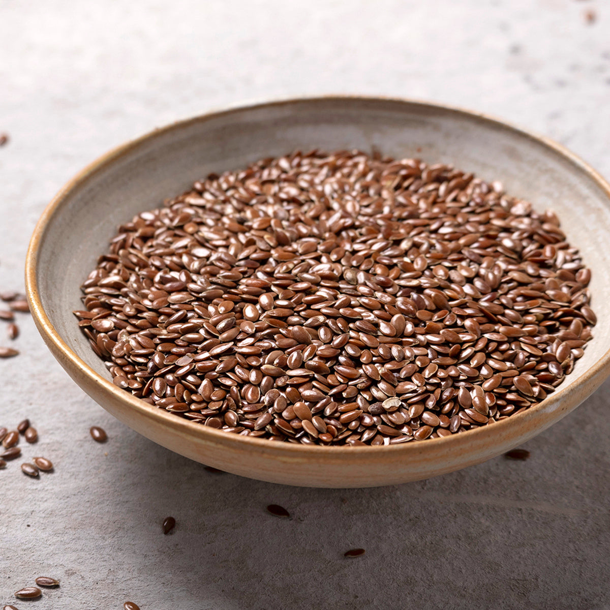 Whole Food Earth brown flaxseed, organic linseed nuts, close-up of whole seeds for healthy cooking and baking.