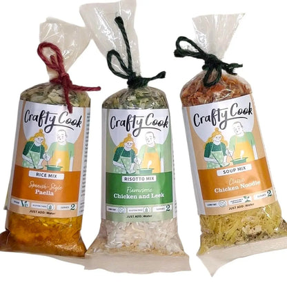 Assorted savory mini snacks from Crafty Cook, featuring camper-themed orange van packaging in a 3-pack collection.