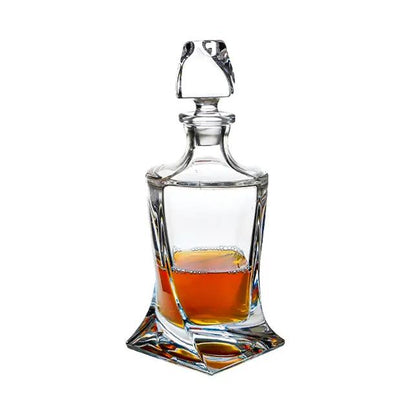 Crystalite 3-piece whiskey decanter set by Glassware UK with three 0.85L glass decanters and stoppers on a wooden tray.