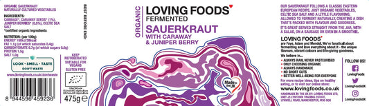Organic sauerkraut with caraway and juniper berries in a glass jar, showcasing fresh, fermented cabbage from Loving Foods.