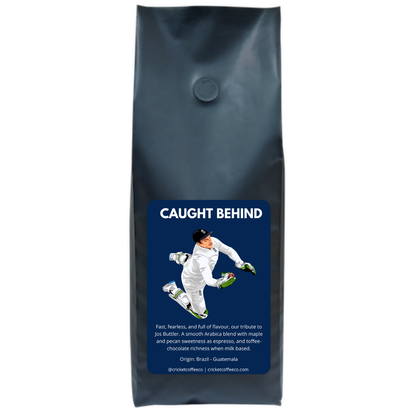 Freshly roasted Clubhouse Roastery Caught Behind coffee in a 500g bag, showcasing rich coffee beans and vibrant packaging.