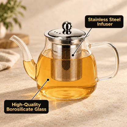 Loose leaf tea set by Camellios with assorted tea infusions and a teapot, displayed on a wooden table.