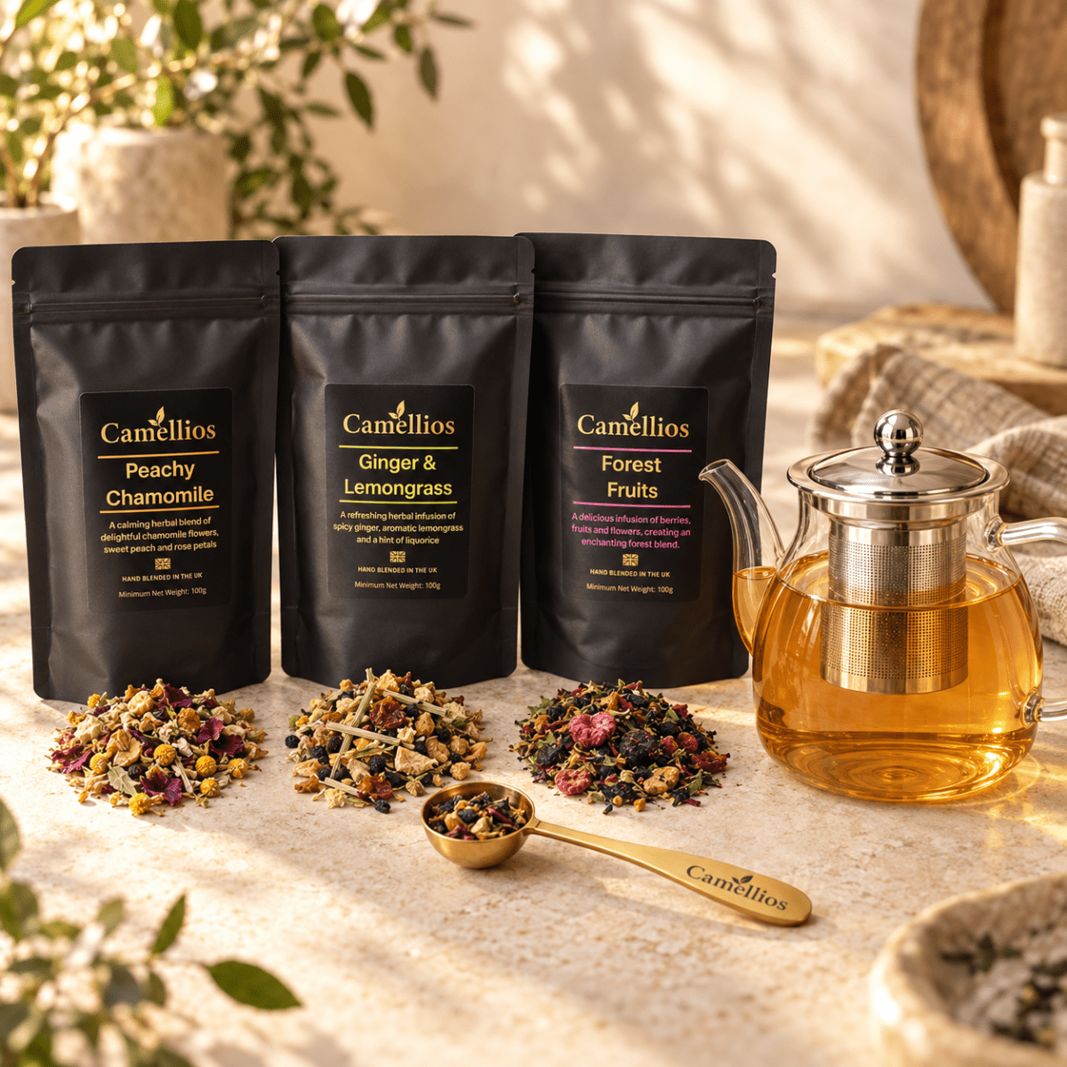 Camellios loose leaf tea set with various tea infusions, including a teapot, cups, and loose tea leaves on a wooden tray.