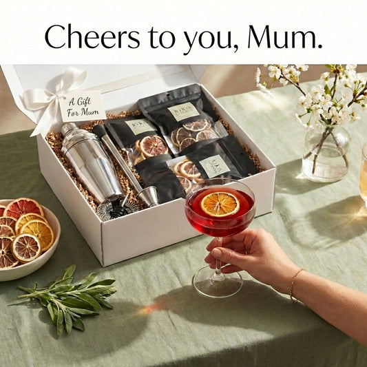 JoJo’s Kitchen Cheers to Mom cocktail kit with shaker, glasses, and ingredients for making festive cocktails at home.