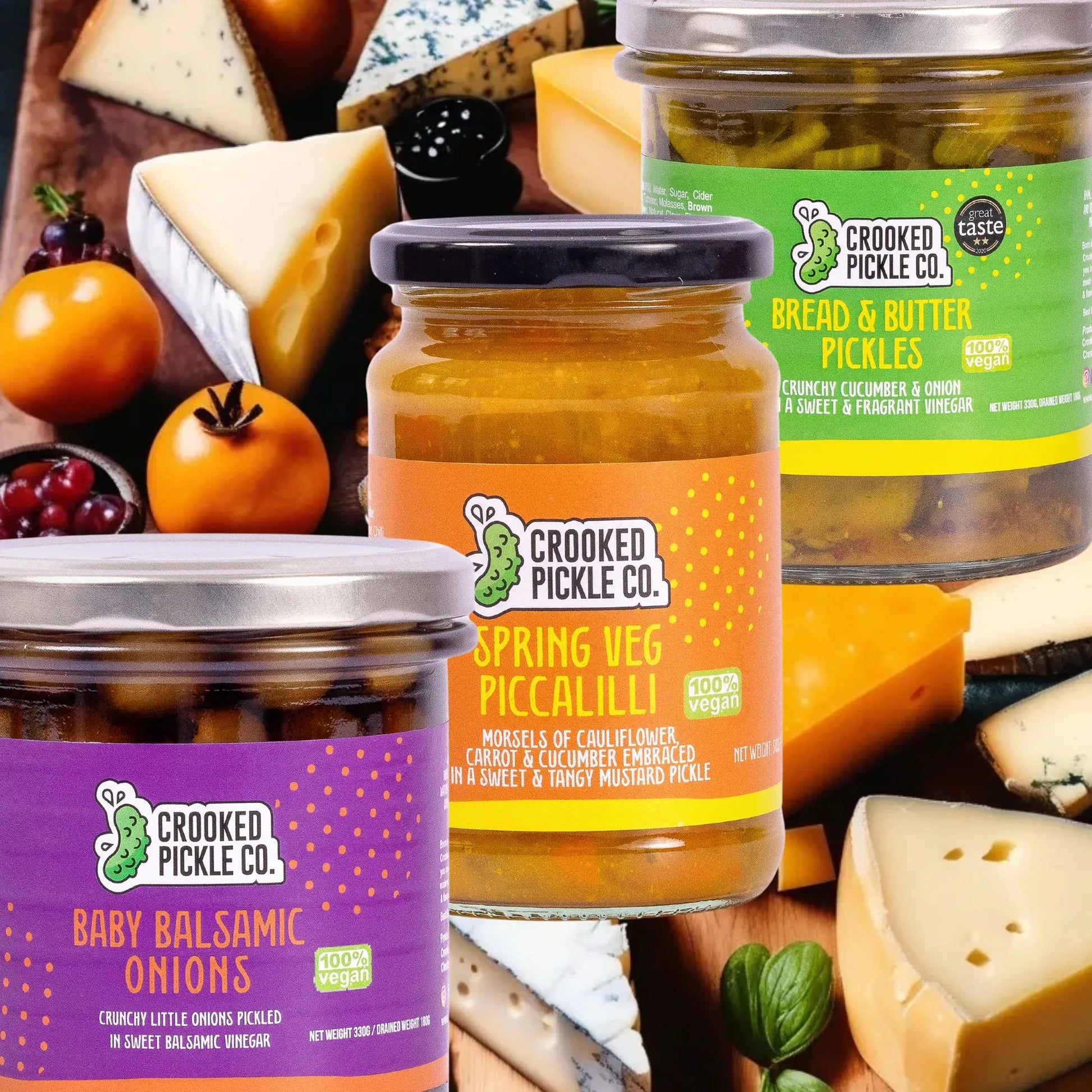 Crooked Pickle Co Cheeseboard Trio set with wooden boards and cheese knives for serving cheese and snacks.