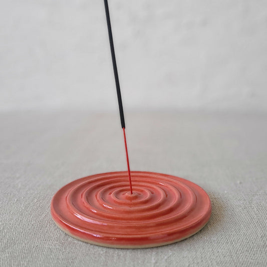 Cherry red classic incense burner by Katie L Thompson Designs, with ornate design and open top for incense sticks.