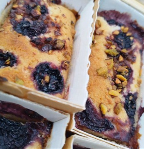 Slices of cherry and pistachio free-from cake from The Healthy Cake Company, showing a colorful layered dessert.