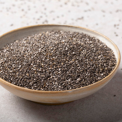 Whole Food Earth chia seeds, small dark seeds for healthy eating, shown in a close-up of the nuts and seeds product image.