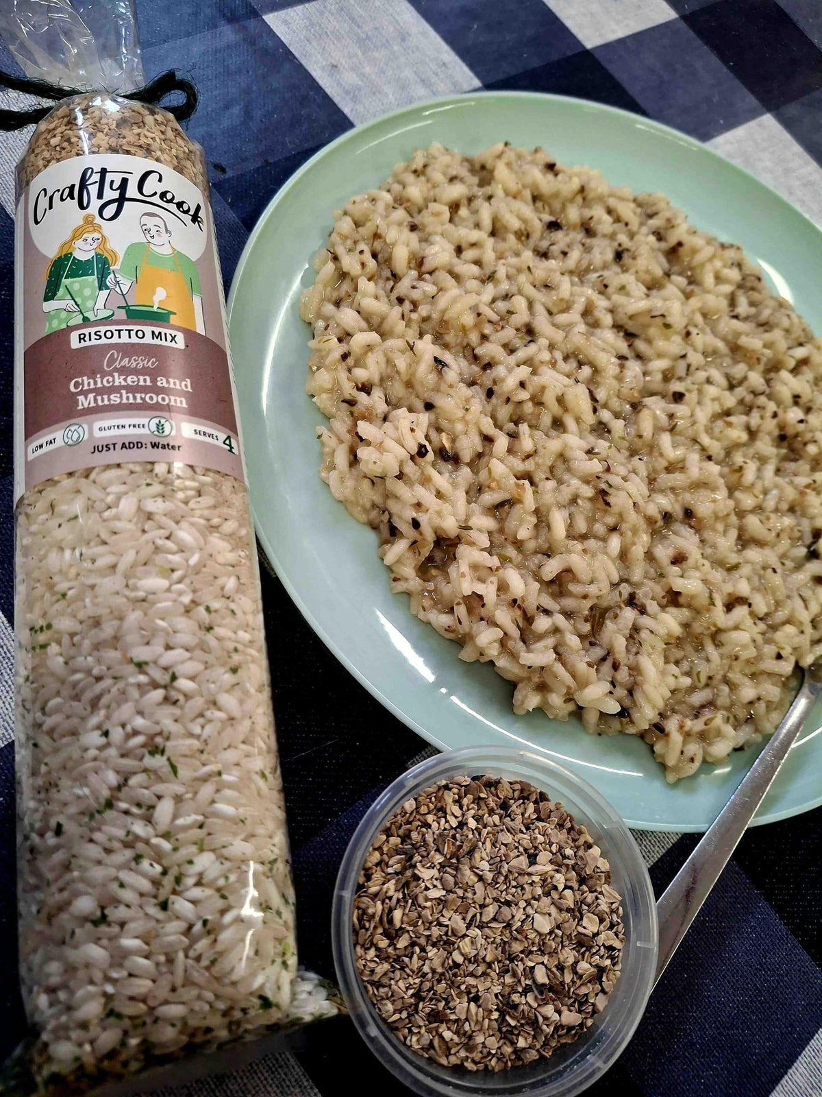 Crafty Cook Easy Meals starter plan with a chicken and mushroom risotto dish on a plate, garnished with herbs.
