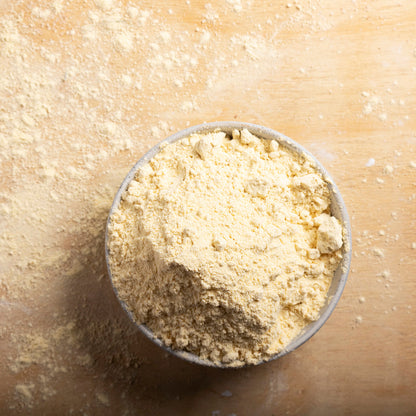 Organic chickpea flour from Whole Food Earth, showing a close-up of the golden, finely ground chickpea flour in a bowl.