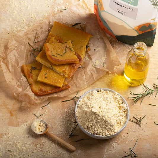 Organic chickpea flour from Whole Food Earth, shown in a natural kitchen setting, ideal for gluten-free cooking and baking.