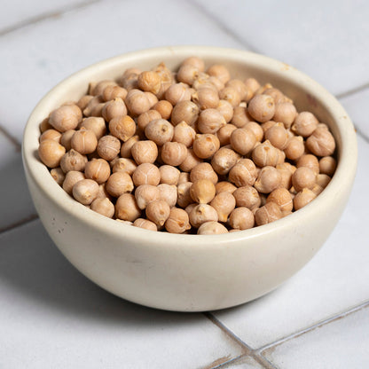 Whole Food Earth 8mm chickpeas for hummus, shown in a close-up image, highlighting their size and texture for beans and pulses.