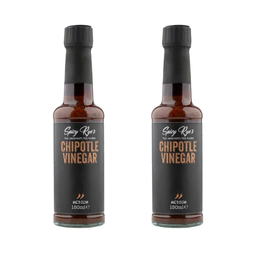Two bottles of Spicy Ryes Chipotle Vinegar with dark glass bottles and labels featuring smoky chipotle peppers.