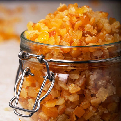 Dried chopped mixed citrus peel from Whole Food Earth, showing vibrant orange and yellow citrus pieces in a square image.