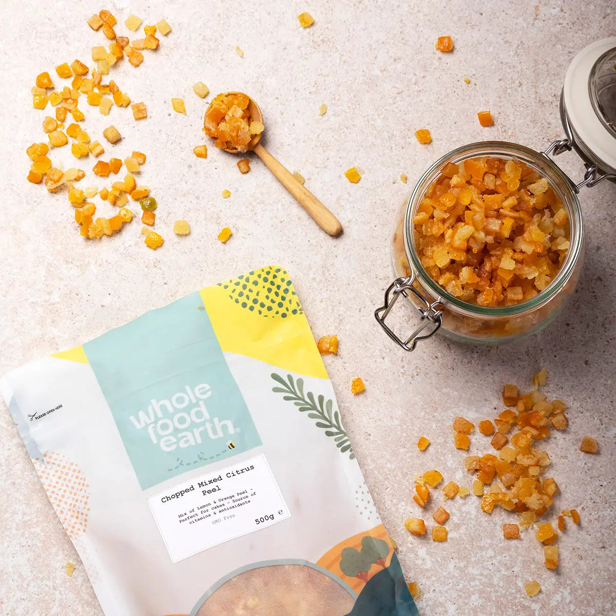 Dried chopped mixed citrus peel from Whole Food Earth, showcasing vibrant orange and yellow citrus pieces in a natural setting.