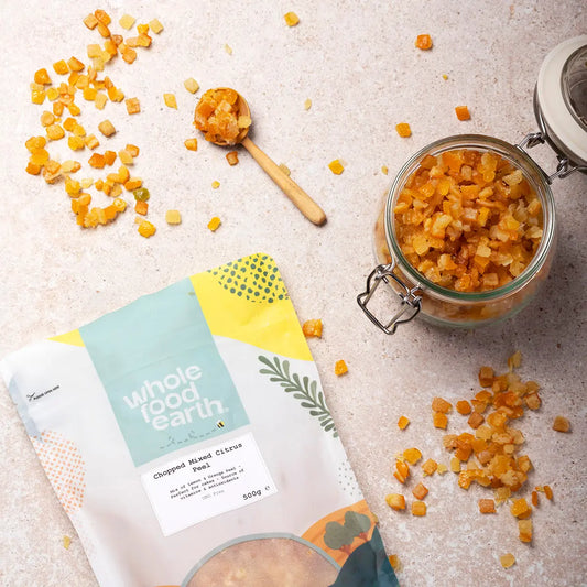 Dried chopped mixed citrus peel from Whole Food Earth, showcasing vibrant orange and yellow citrus pieces in a natural setting.
