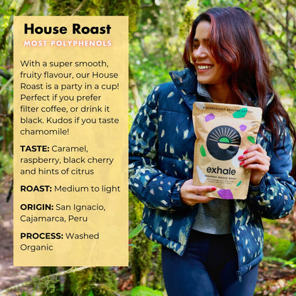 Organic house roast coffee by Exhale Healthy Coffee, showing freshly brewed coffee in a mug with beans and a rustic background.
