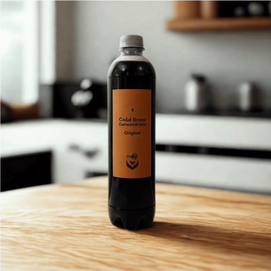 Bottle of Ignite Coffee Co's decaf cold brew concentrate with a dark coffee color and label, ready for mixing or serving.