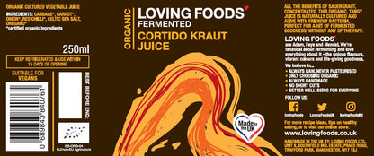 Assorted bottles of Loving Foods fermented vegetable juice case featuring colorful labels and fresh vegetables in the background.