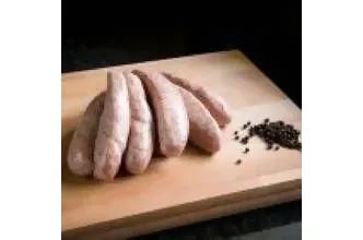 Cracked black pepper sausages from Primrose Herd, cooked and sliced, showing dark sausage links with black cracked pepper seasoning.