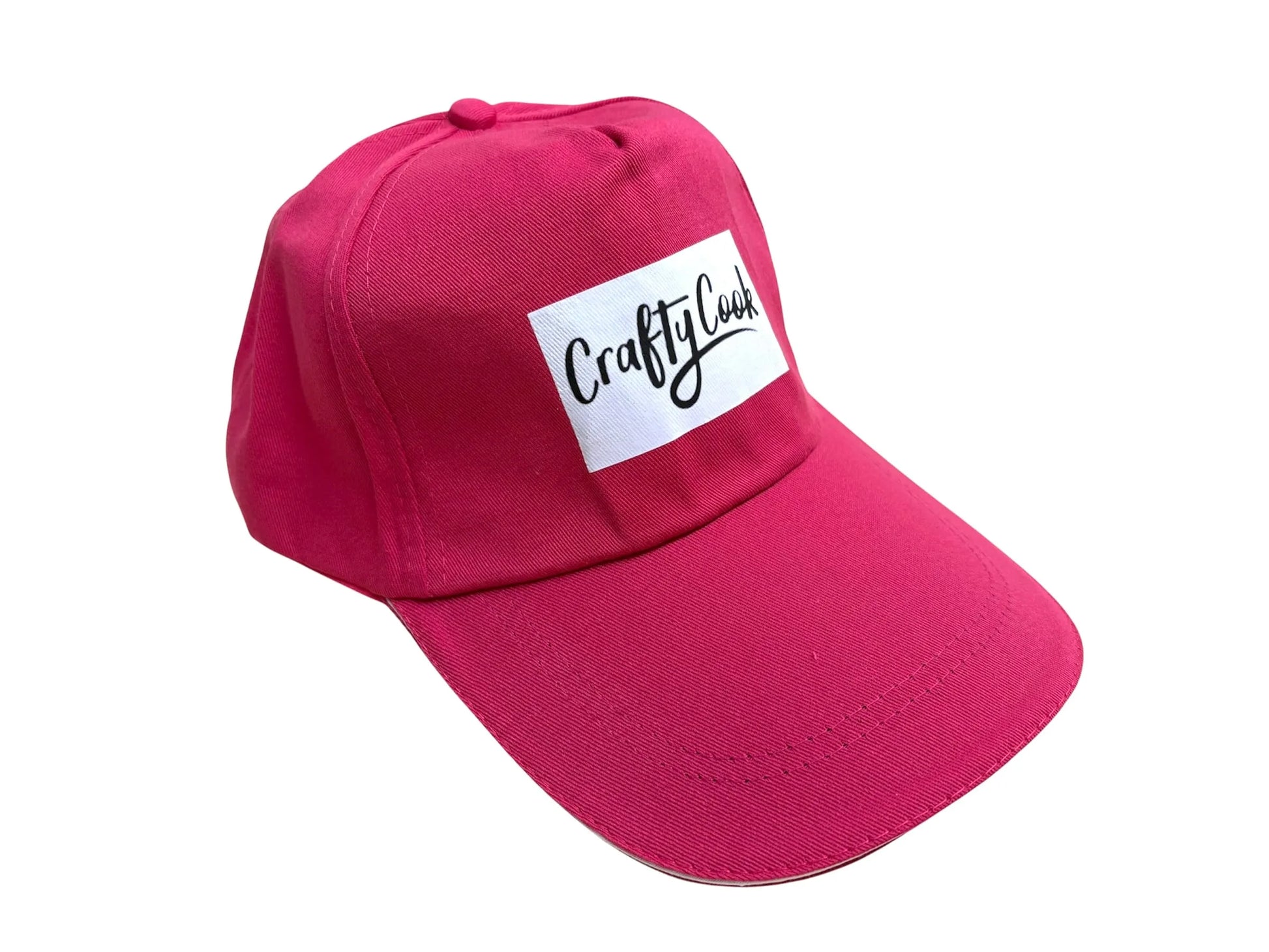 Pink Crafty Cook cap made of soft fabric, featuring a casual all-purpose design perfect for cooking or everyday wear.