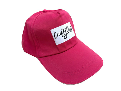 Pink Crafty Cook cap made of soft fabric, featuring a casual all-purpose design perfect for cooking or everyday wear.