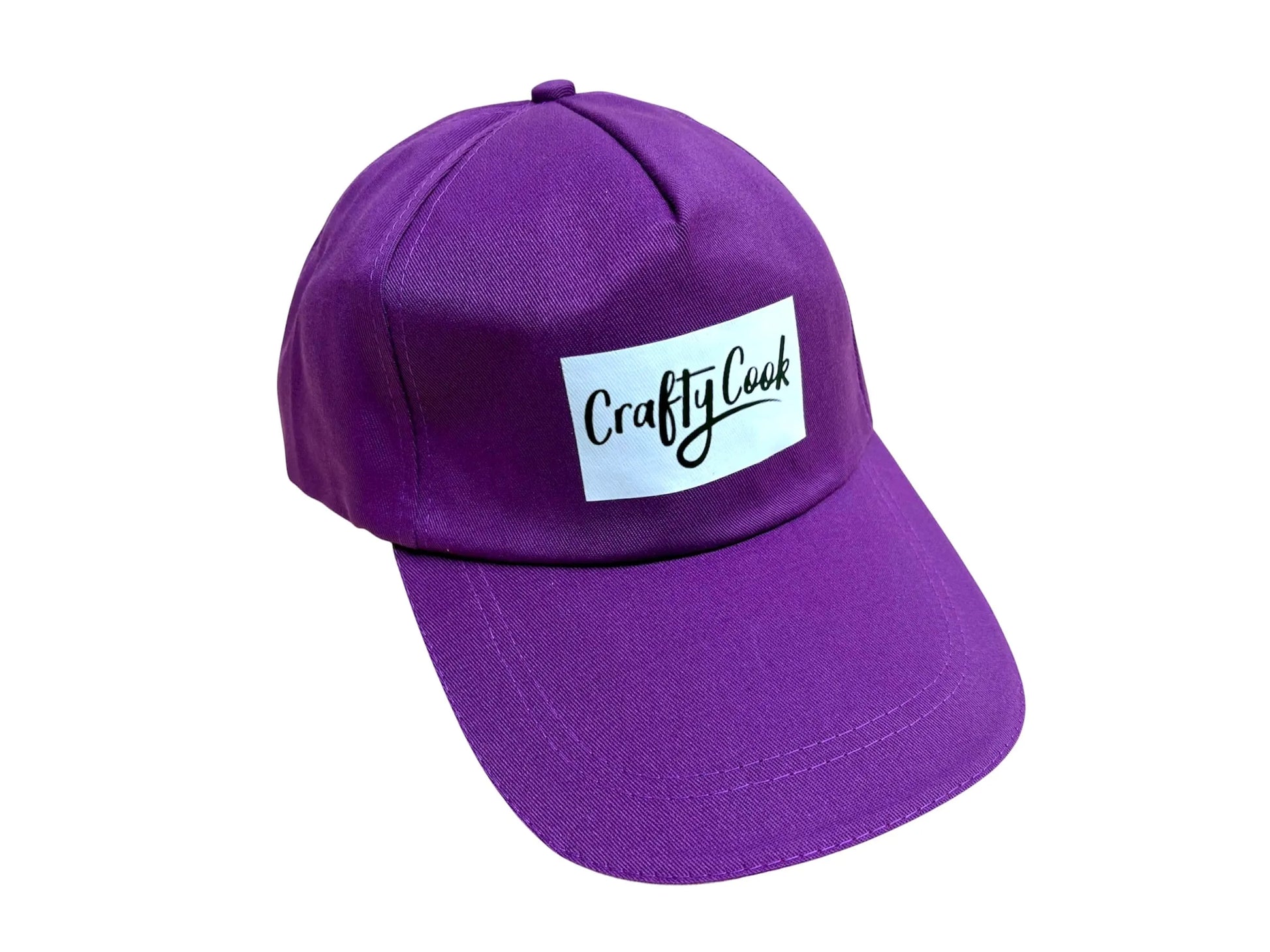 Purple Crafty Cook cap with adjustable strap, made of soft fabric, perfect for cooking or casual wear.