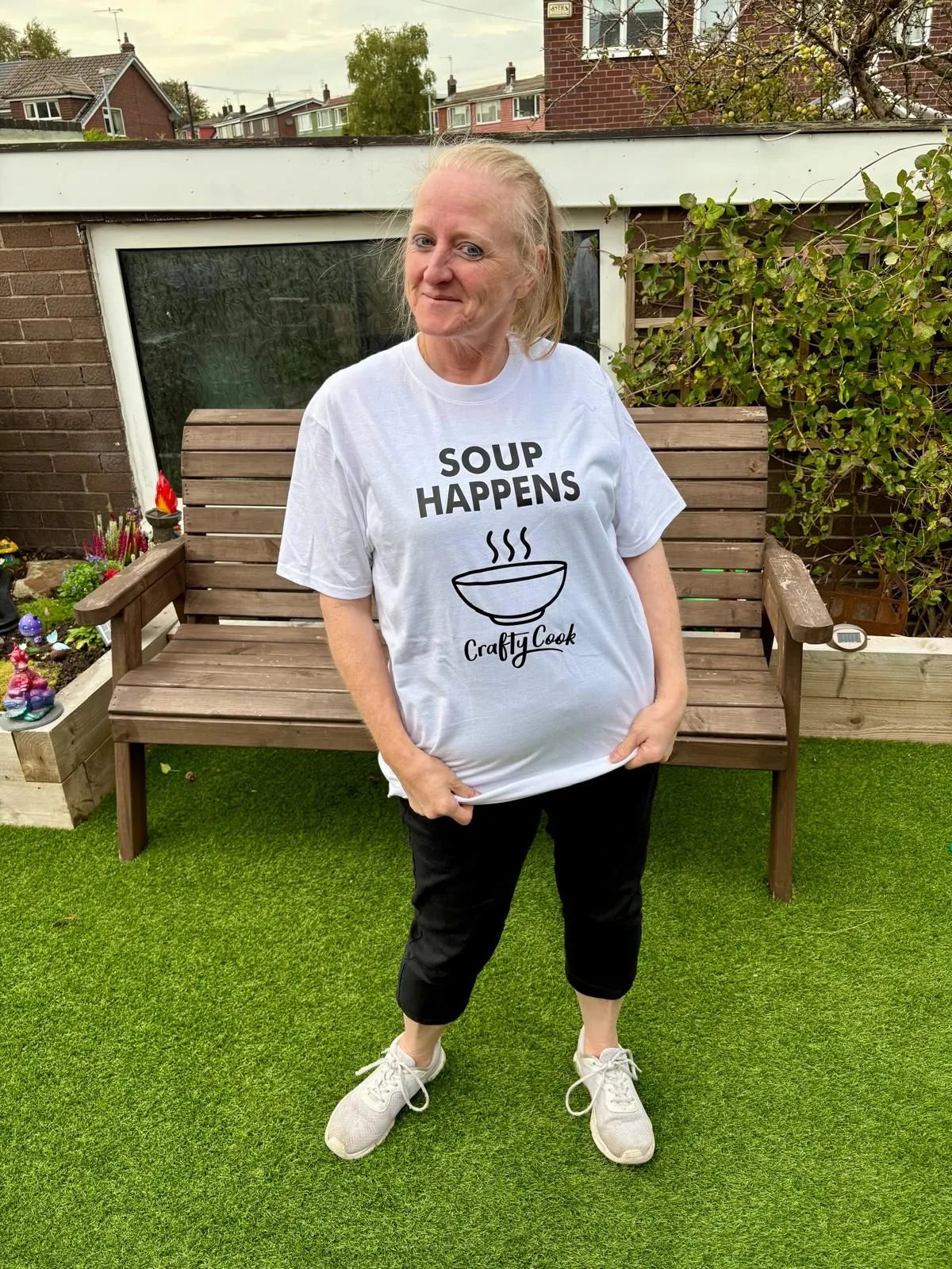 Crafty Cook Soup Happens T-shirt featuring humorous text and casual fit, displayed on a plain background.
