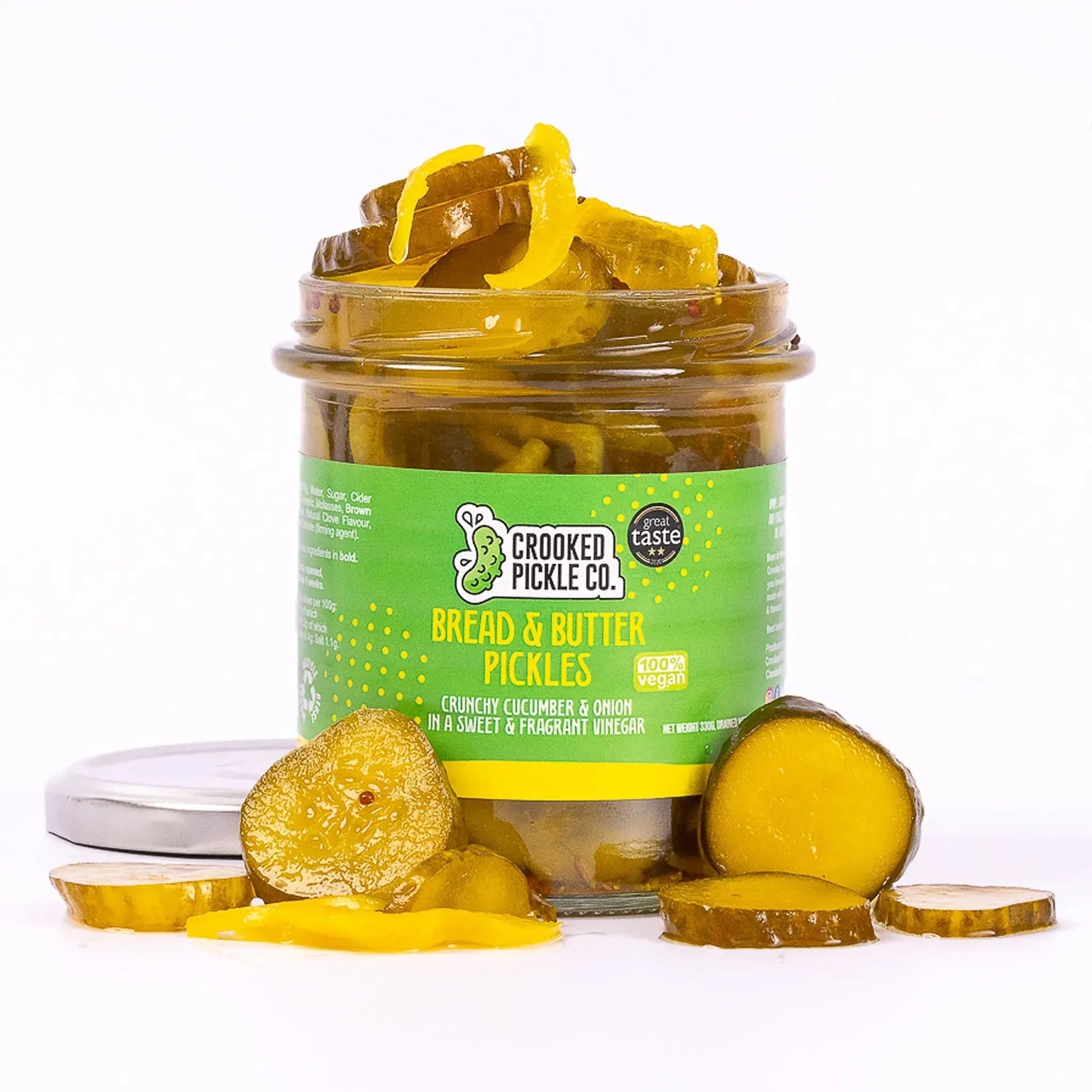 Jar of Crooked Pickle Co. bread and butter pickles with sliced pickles visible inside on a white background.