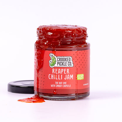 Reaper Chilli Jam by Crooked Pickle Co displayed in a jar, showcasing its rich, spicy appearance with chipotle and soy ingredients.