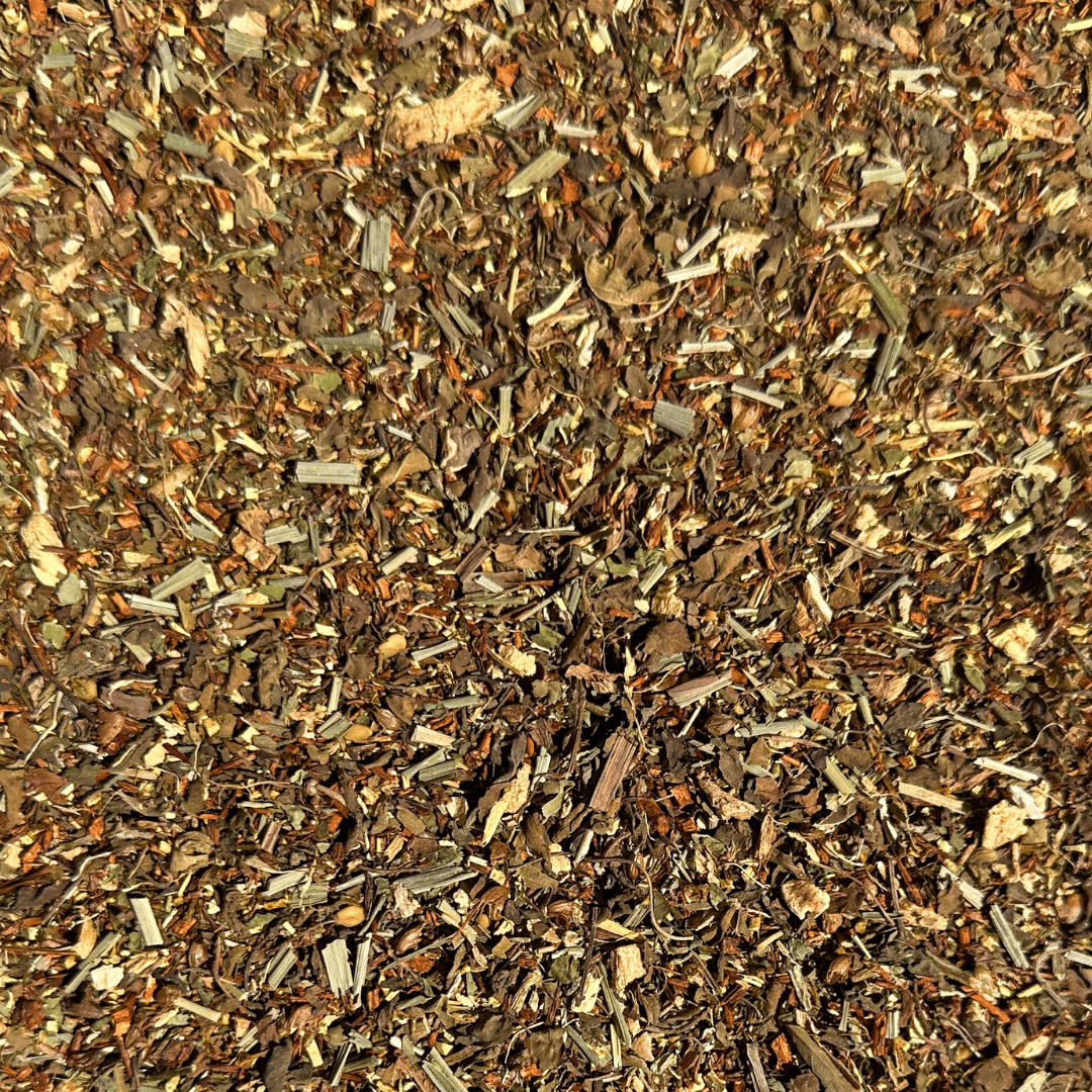 Loose leaf Dandelion Detox herbal tea by Porter Hill Tea Company in a clear glass jar with dried dandelion leaves and herbs.