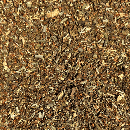 Loose leaf Dandelion Detox herbal tea by Porter Hill Tea Company in a clear glass jar with dried dandelion leaves and herbs.