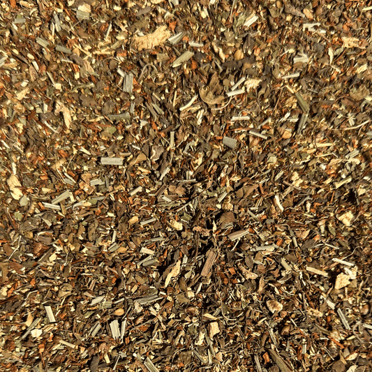 Loose leaf Dandelion Detox herbal tea by Porter Hill Tea Company in a clear glass jar with dried dandelion leaves and herbs.