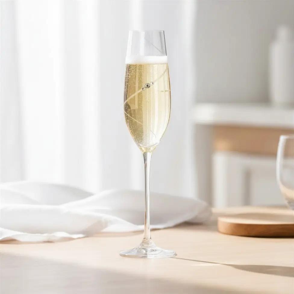 Set of 6 Glassware UK diamanté champagne flutes with sparkling embellishments, displayed in a gift box on a stylish table.