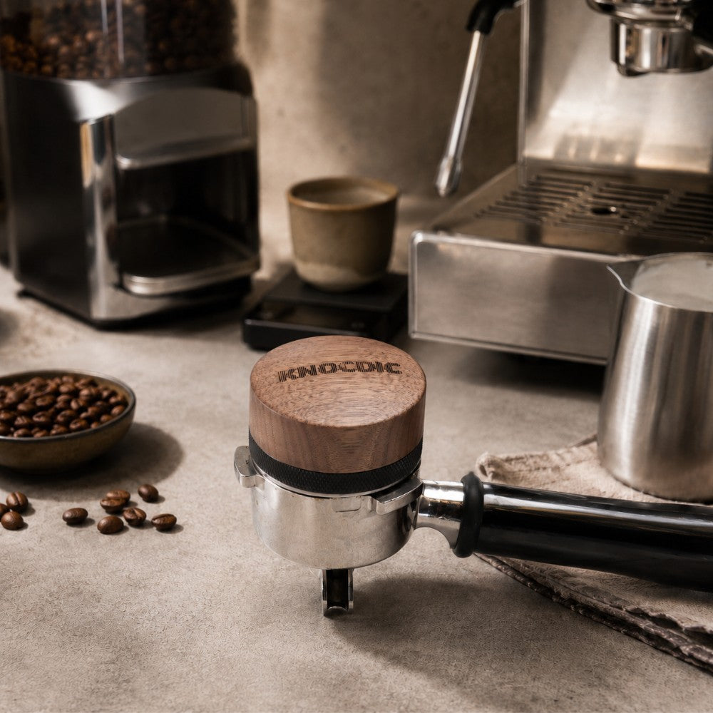 KNOCDIC® walnut adjustable espresso distribution tool in use, showing its ergonomic handle and precision for coffee tamping.